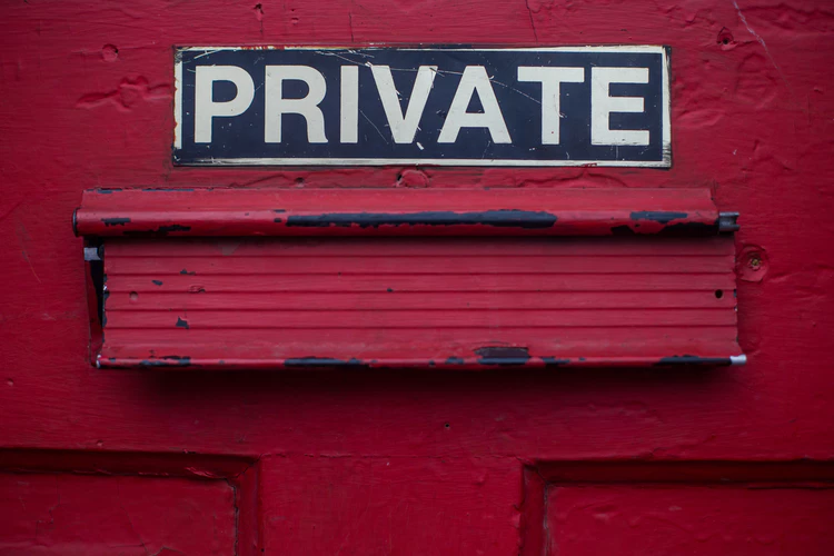 Sign on a door marked private, a place where where no one can hear the things people do or say 