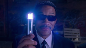 Will Smith from the movie men black about to Zap someone with sunglasses on 
