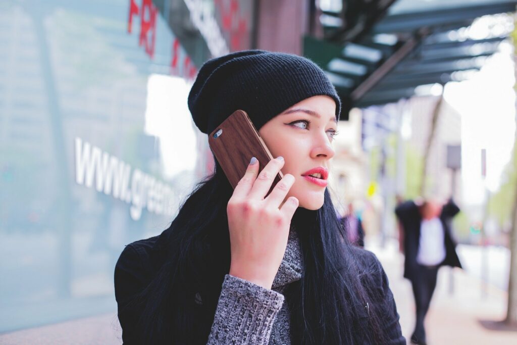 Photo of a woman holding her cell phone up to her ear
